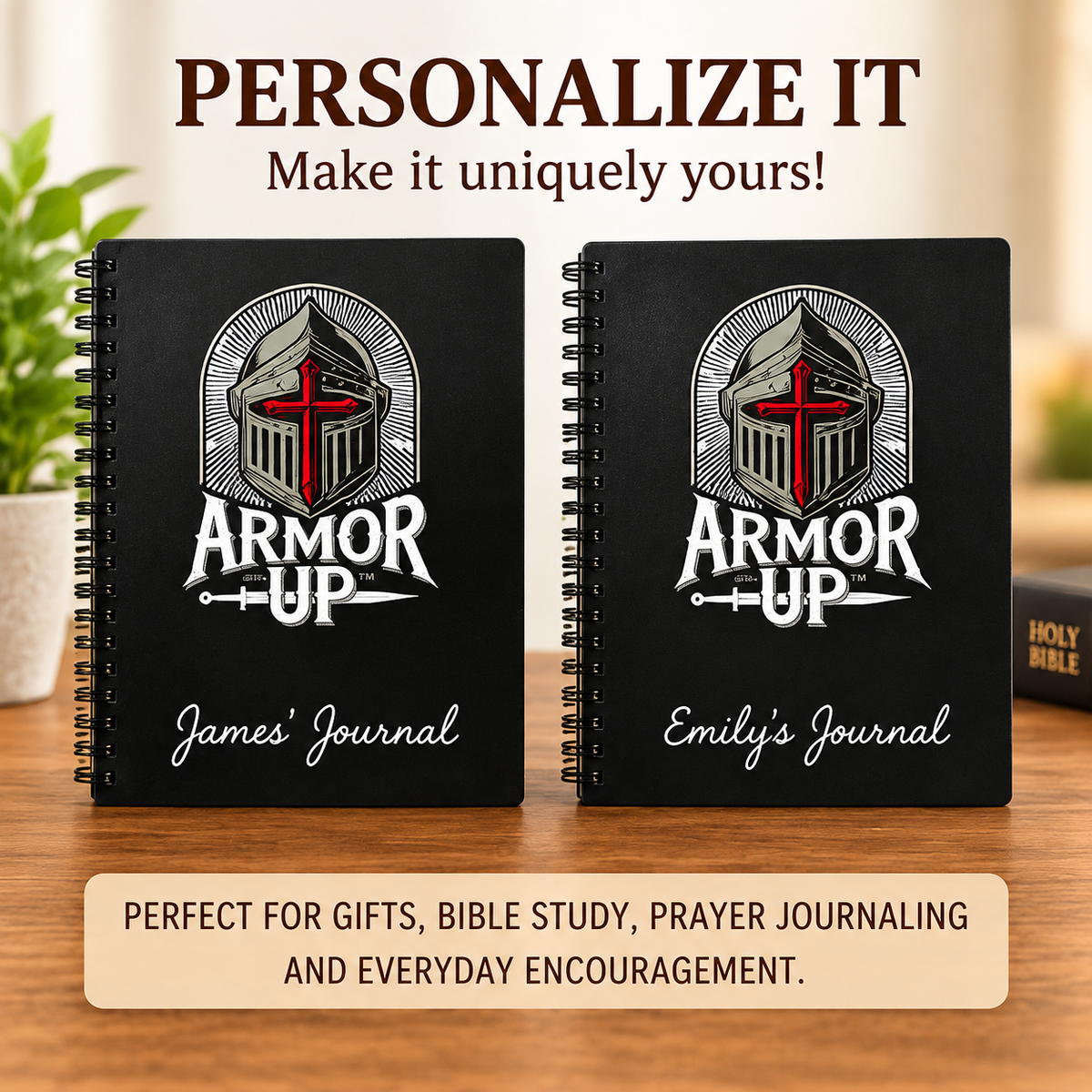 Two black spiral-bound journals titled 'ARMOR UP' with a red cross and silver helmet graphic, shown on a wooden surface with promotional text above and below.