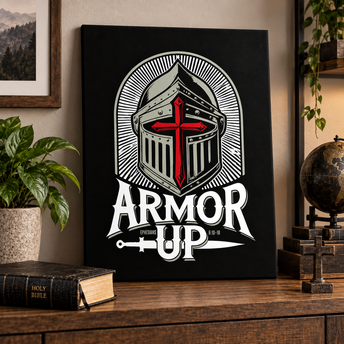 A black canvas print featuring a stylized knight helmet with a red cross and the words 'ARMOR UP' in white, displayed on a wooden shelf in a room setting with a plant, book, and globe.