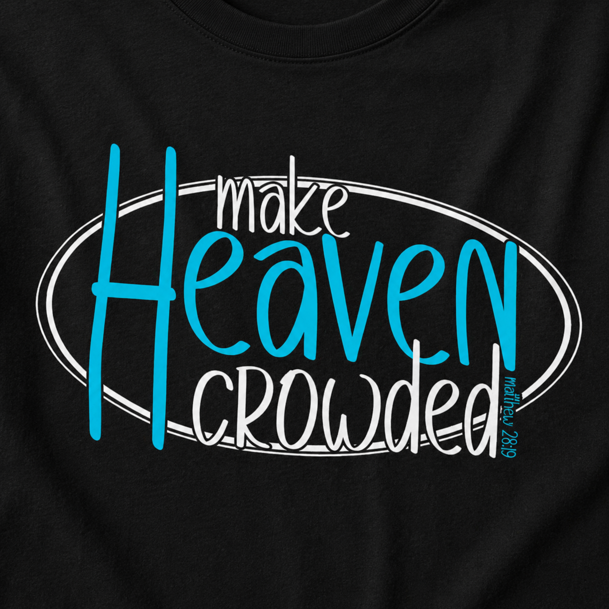 Close-up of a black T-shirt with a large front graphic reading 'make Heaven crowded' in white and bright blue lettering inside an oval outline.