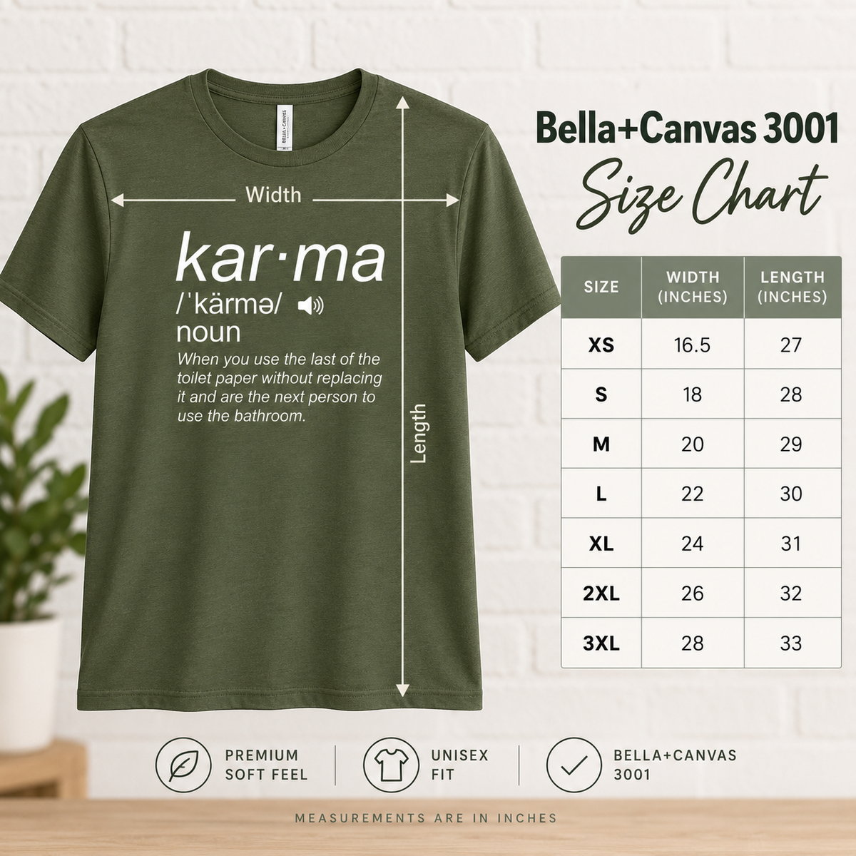 An olive green Bella+Canvas 3001 t-shirt shown with measurement arrows and a size chart table on a light wood background. The chart lists sizes XS through 3XL with corresponding width and length measurements.